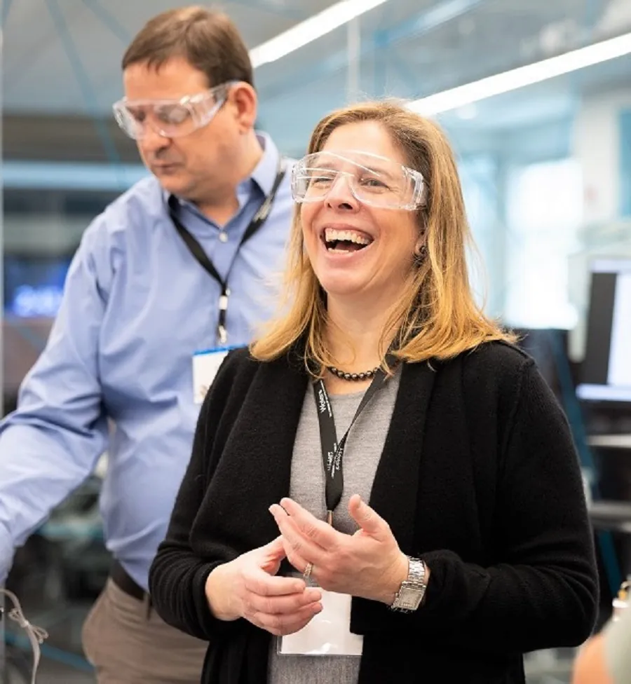 belinda hyde with protective glasses in lab smiling