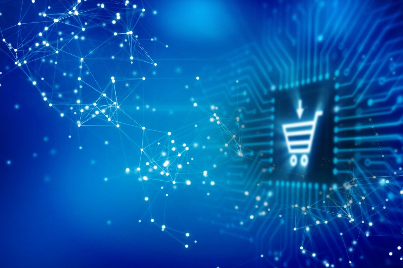 Glowing shopping cart icon on top of blue circuit board and plexus networking patterns