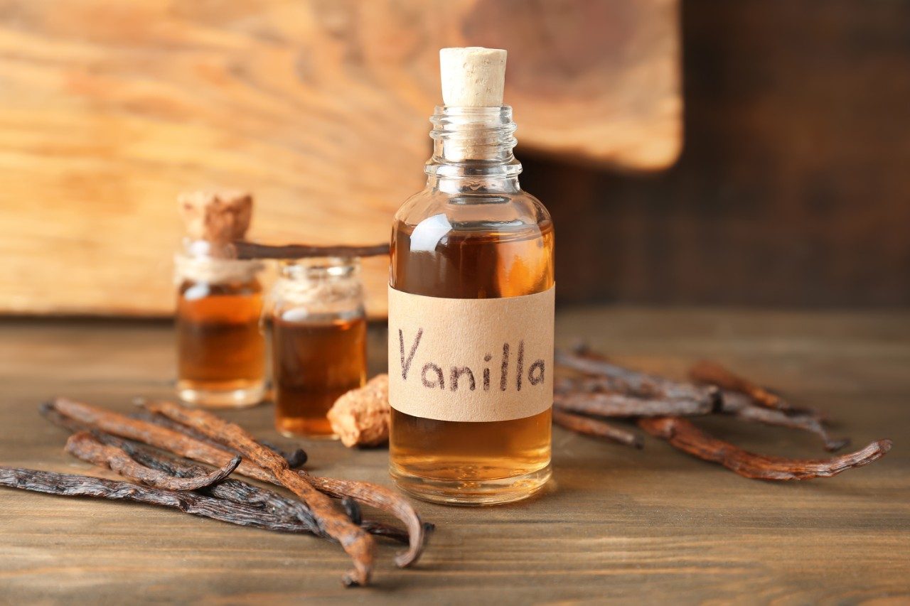 Glass bottle with vanilla extract and bean pods