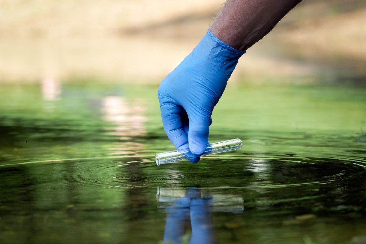 Hand in glove collects water in a test tube