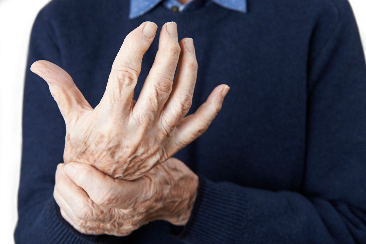 Elderly man with arthritis in hands