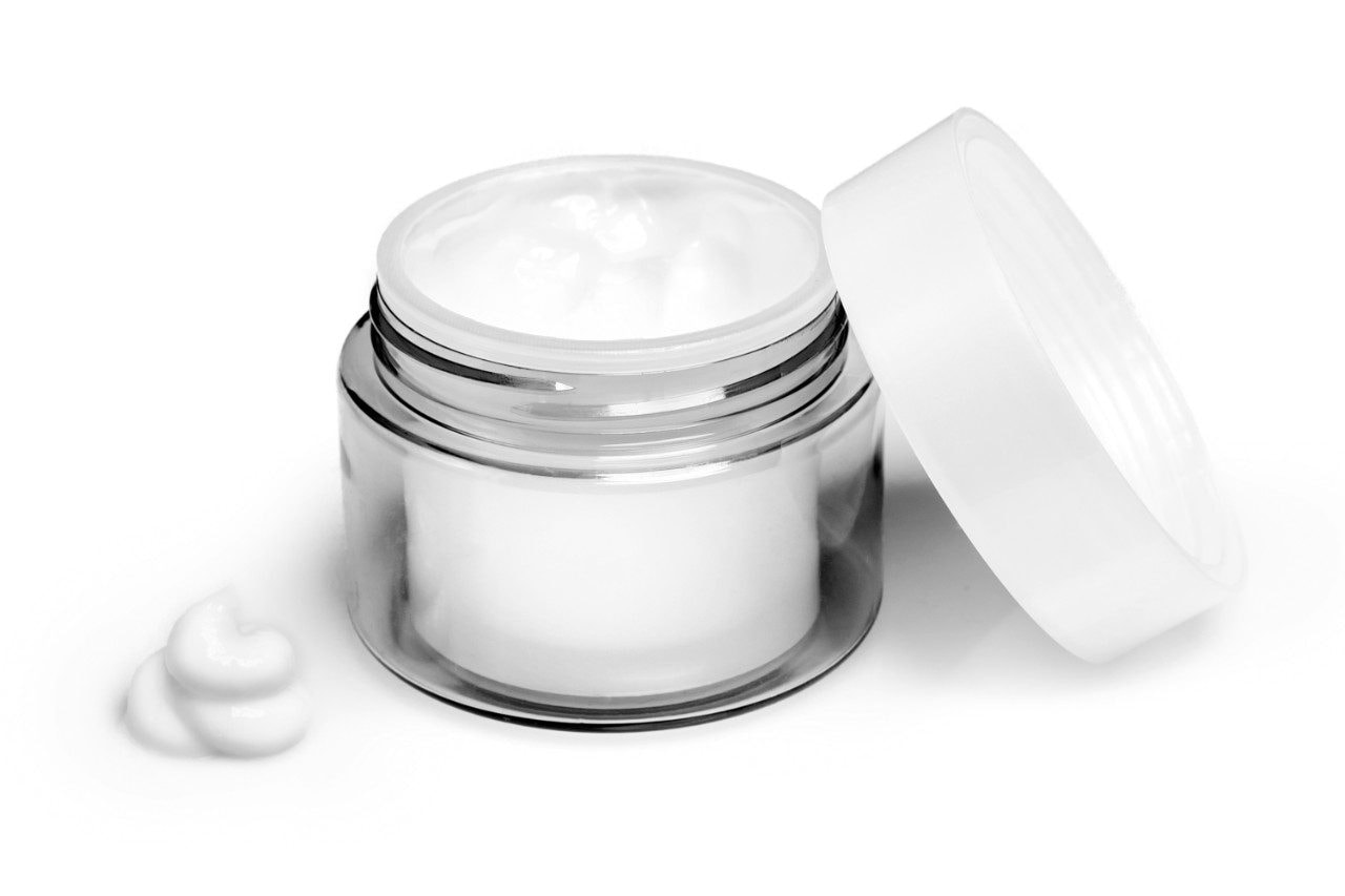 Moisturizing face cream in glass jar