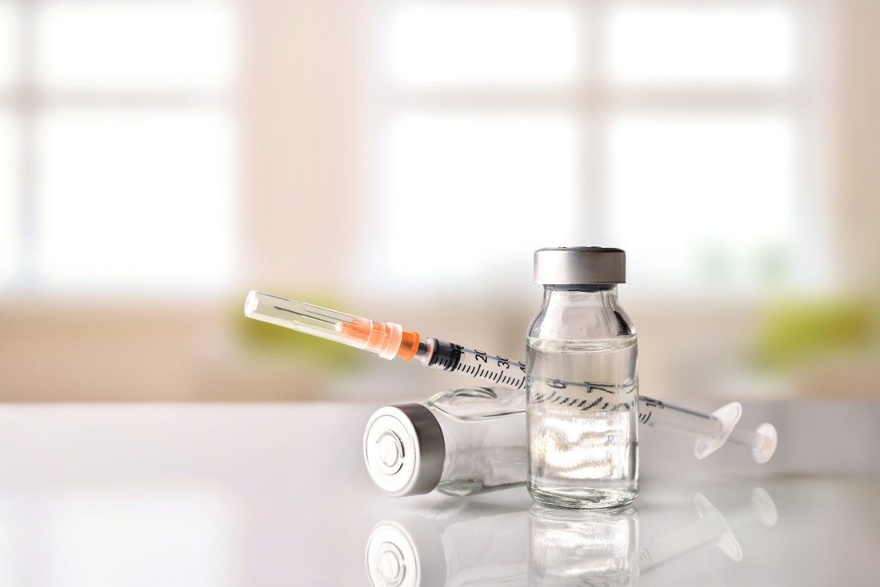 Vials with medication and syringe